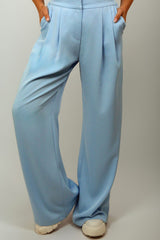 Zina Set featuring blue embroidered details and floral accents on a belt and cuffs.