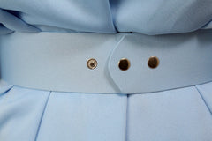 Close-up of the blue belt and buttons on the Zina Set, showcasing elegant design details and craftsmanship.